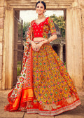 MUSTARD YELLOW HAND CRAFTED PATOLA SILK LEHENGA WITH EMBROIDERED SILK BLOUSE