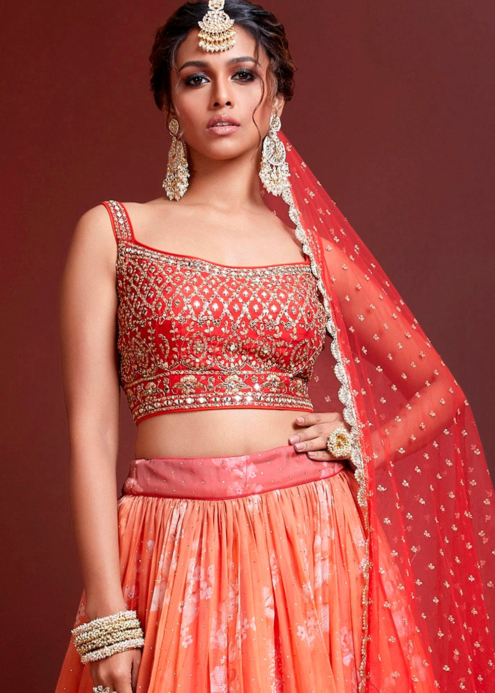 SHADED SUNSET ORANGE SILK LEHENGA WITH HEAVY EMBROIDERED BLOUSE