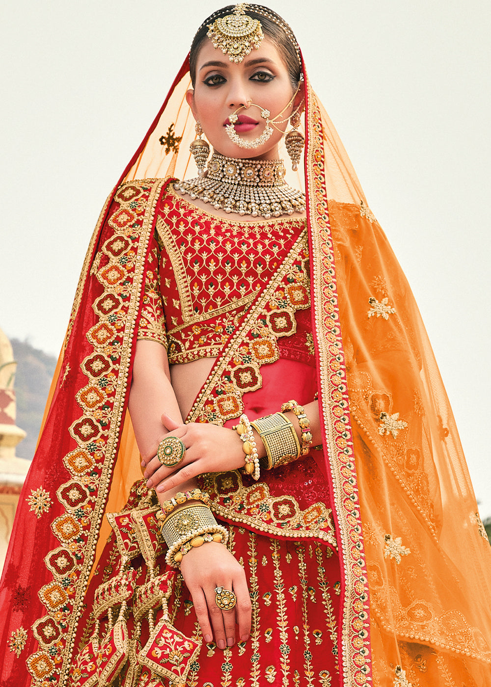 RED HEAVY EMBROIDERED DESIGNER BRIDAL LEHENGA