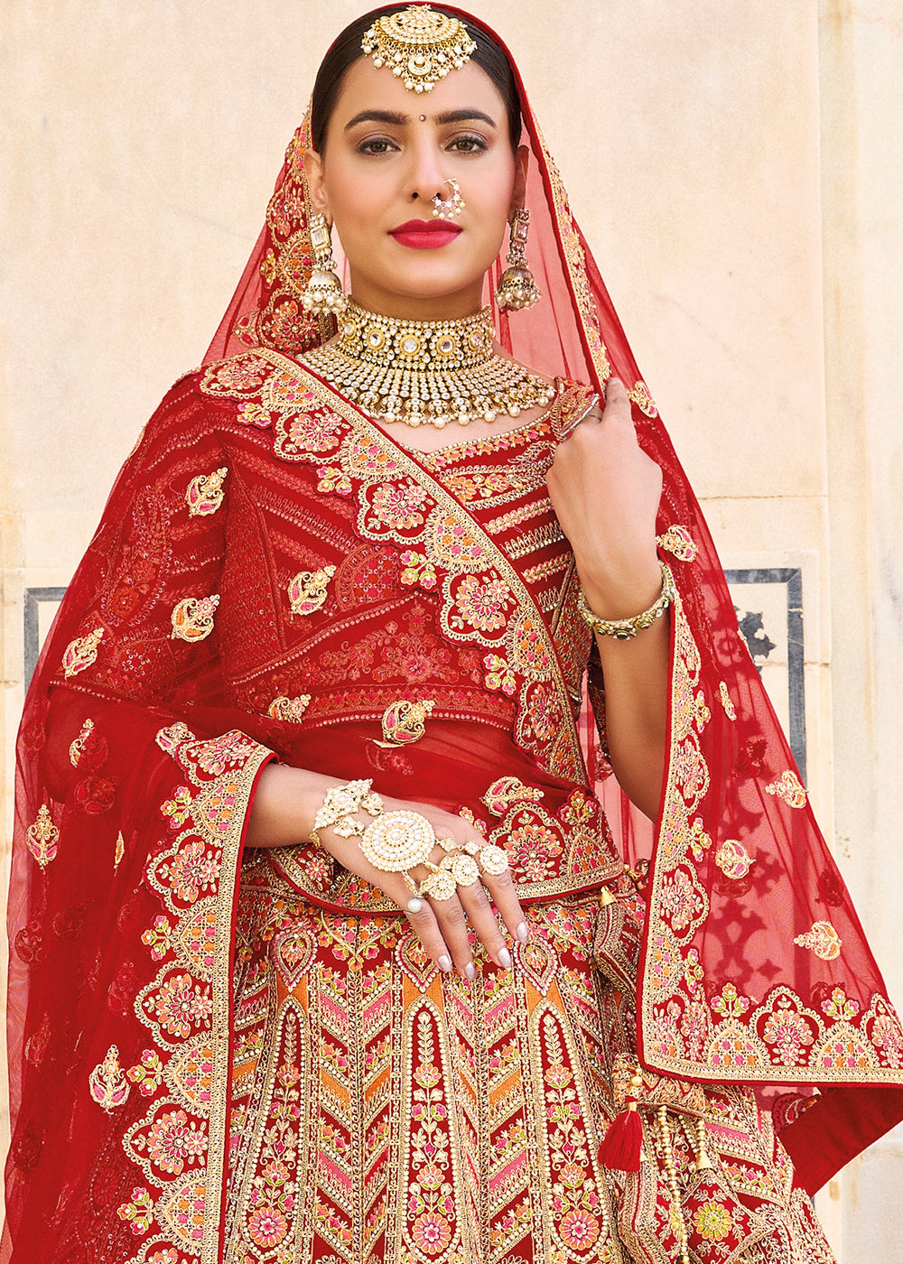 RED HEAVY EMBROIDERED DESIGNER BRIDAL LEHENGA
