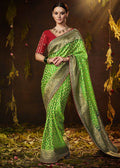 LIME GREEN WOVEN PURE GEORGETTE BANDHANI SAREE WITH BANARASI SILK BORDER & HEAVY EMBROIDERED BLOUSE