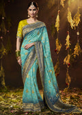 AQUA BLUE WOVEN PURE GEORGETTE BANDHANI SAREE WITH BANARASI SILK BORDER & HEAVY EMBROIDERED BLOUSE