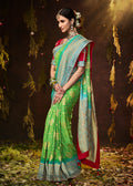 LIME GREEN WOVEN PURE GEORGETTE BANDHANI SAREE WITH BANARASI SILK BORDER & HEAVY EMBROIDERED BLOUSE