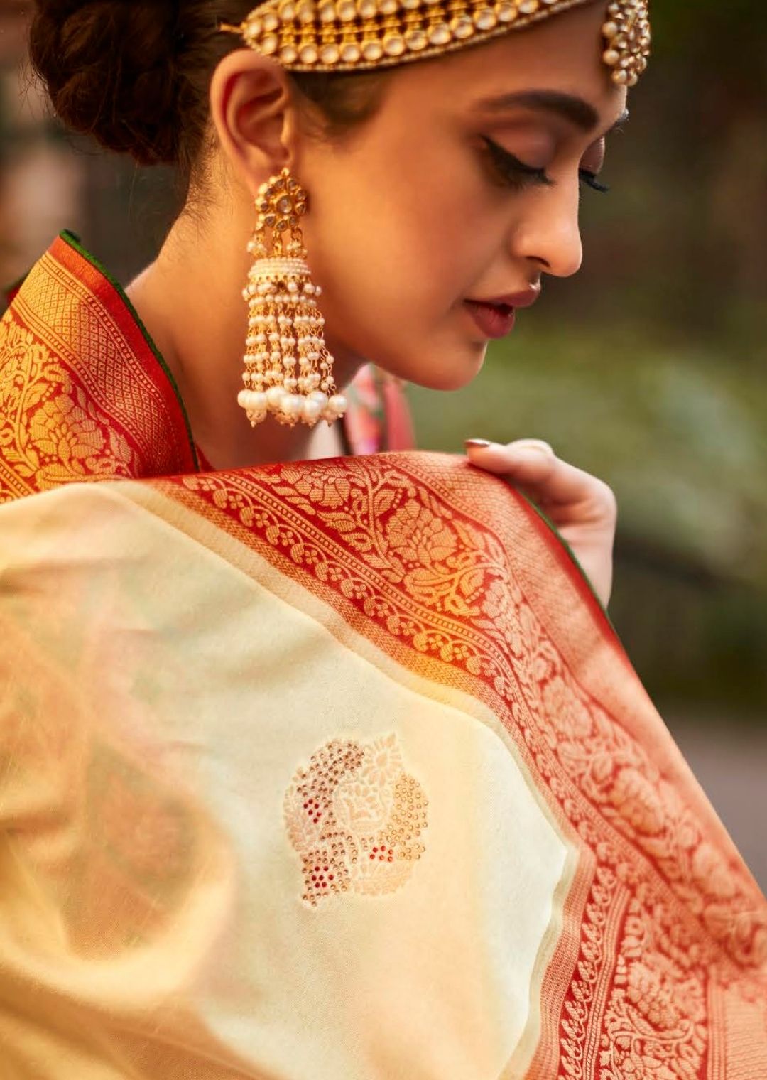 Pearl White Woven Traditional Patola Silk Saree With Embroidered Silk Blouse