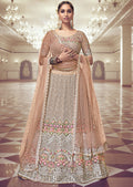 PEACH HEAVY EMBROIDERED PREMIUM NET DESIGNER LEHENGA