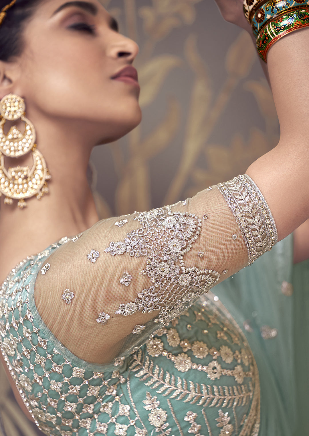 TURQUOISE GREEN HEAVY EMBROIDERED PREMIUM NET DESIGNER LEHENGA