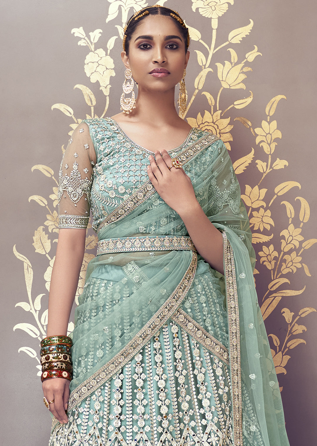 TURQUOISE GREEN HEAVY EMBROIDERED PREMIUM NET DESIGNER LEHENGA