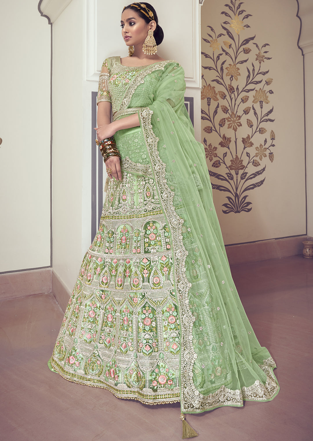 DEEP TEA GREEN HEAVY EMBROIDERED PREMIUM NET DESIGNER LEHENGA