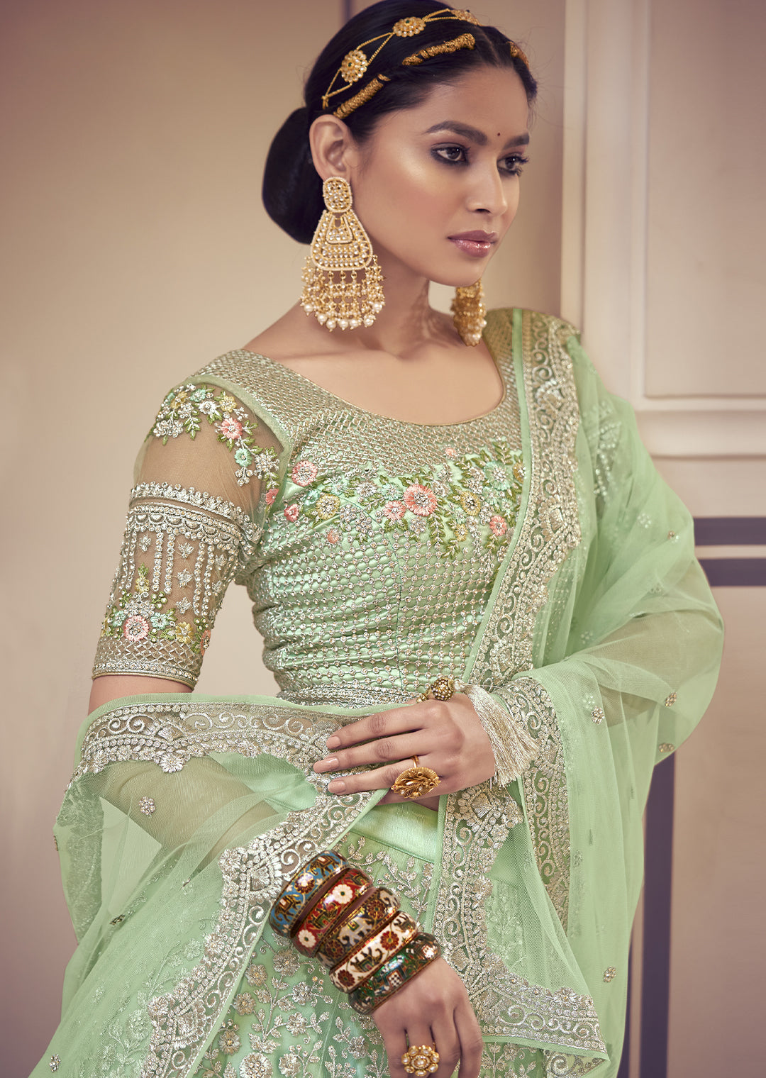 DEEP TEA GREEN HEAVY EMBROIDERED PREMIUM NET DESIGNER LEHENGA