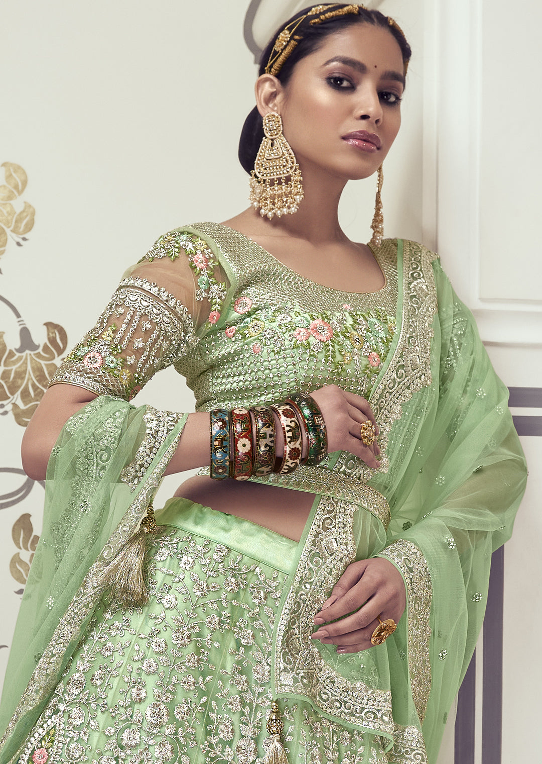 DEEP TEA GREEN HEAVY EMBROIDERED PREMIUM NET DESIGNER LEHENGA