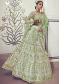 DEEP TEA GREEN HEAVY EMBROIDERED PREMIUM NET DESIGNER LEHENGA