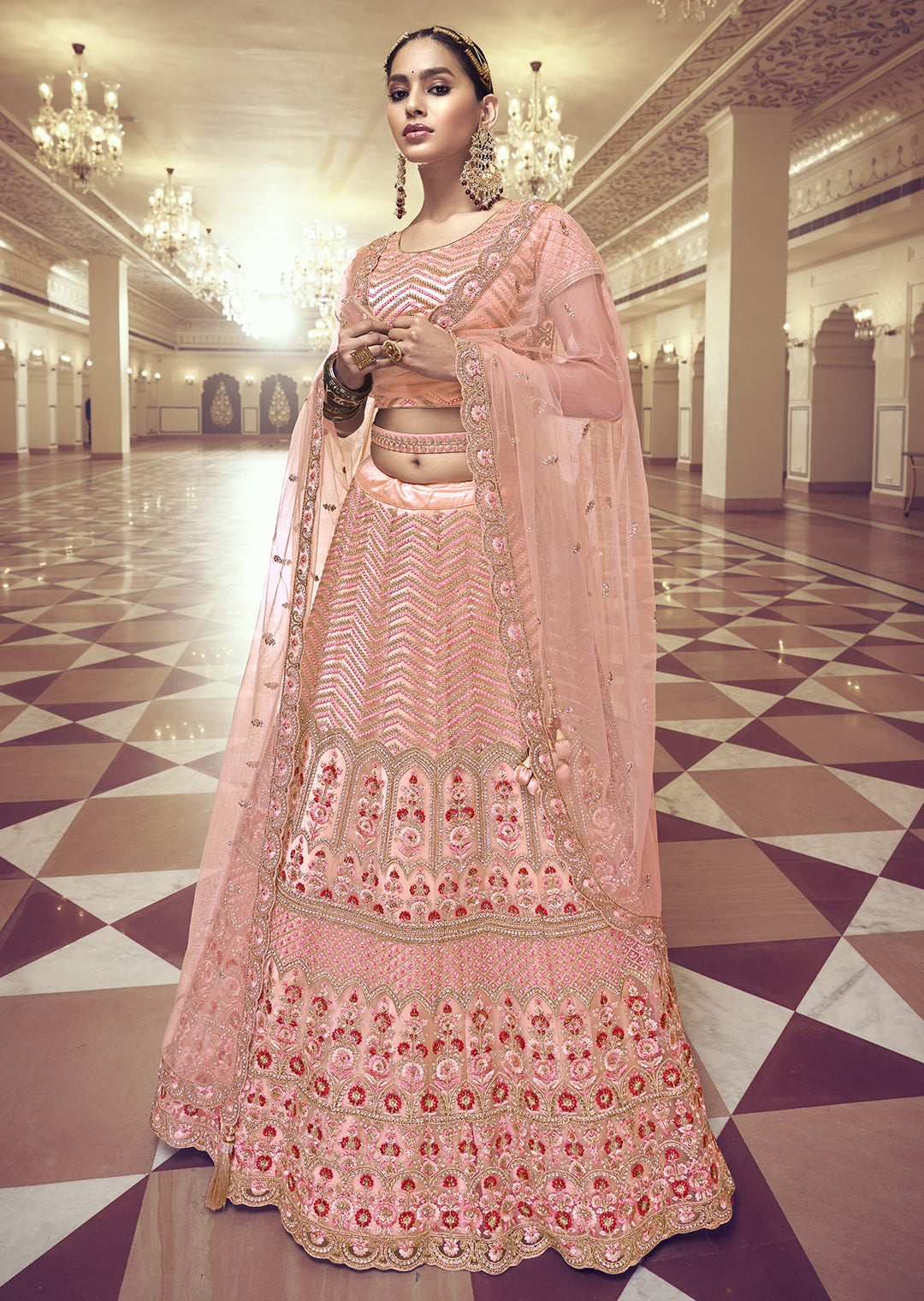 PEACH ORANGE HEAVY EMBROIDERED PREMIUM NET DESIGNER LEHENGA