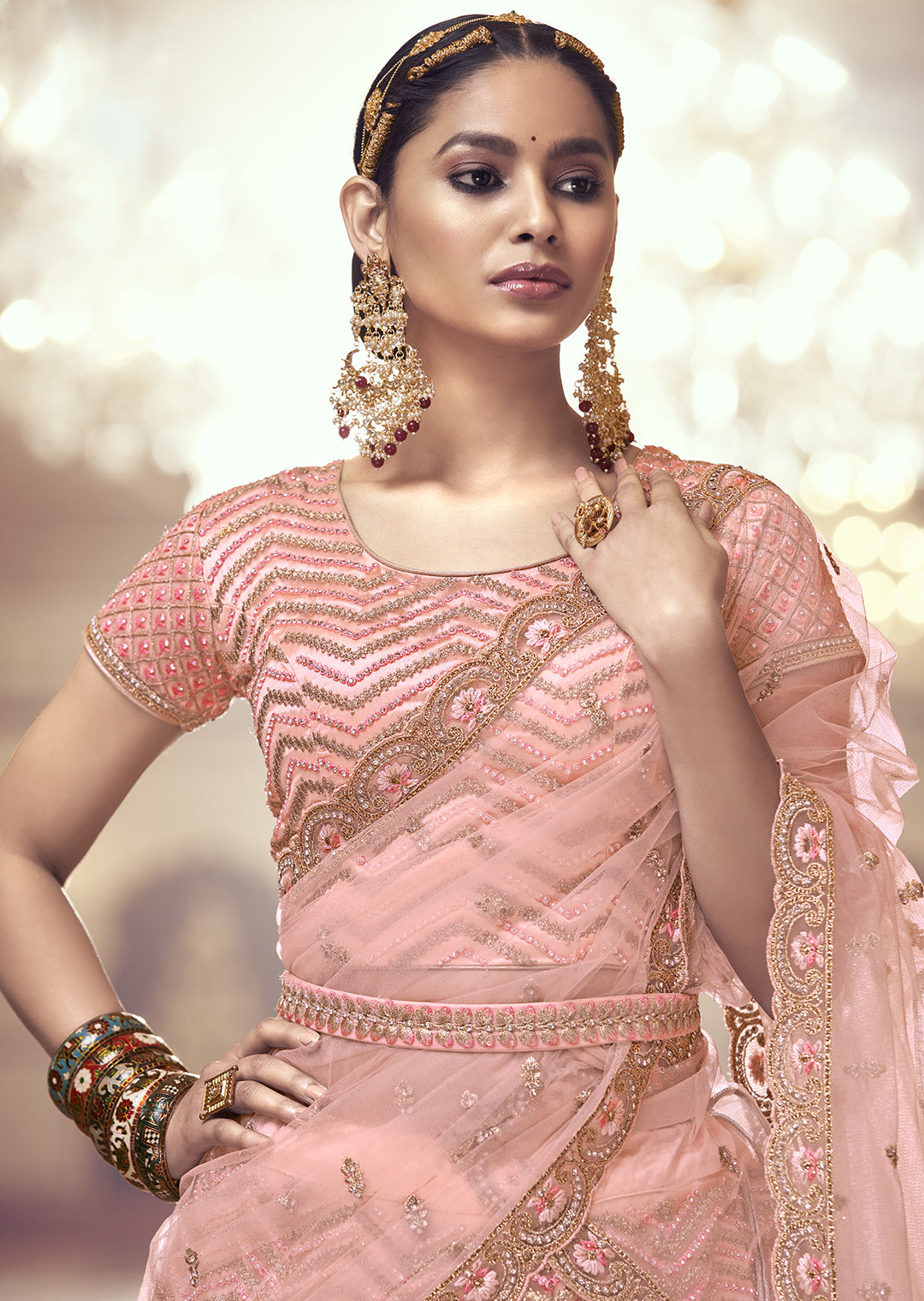PEACH ORANGE HEAVY EMBROIDERED PREMIUM NET DESIGNER LEHENGA