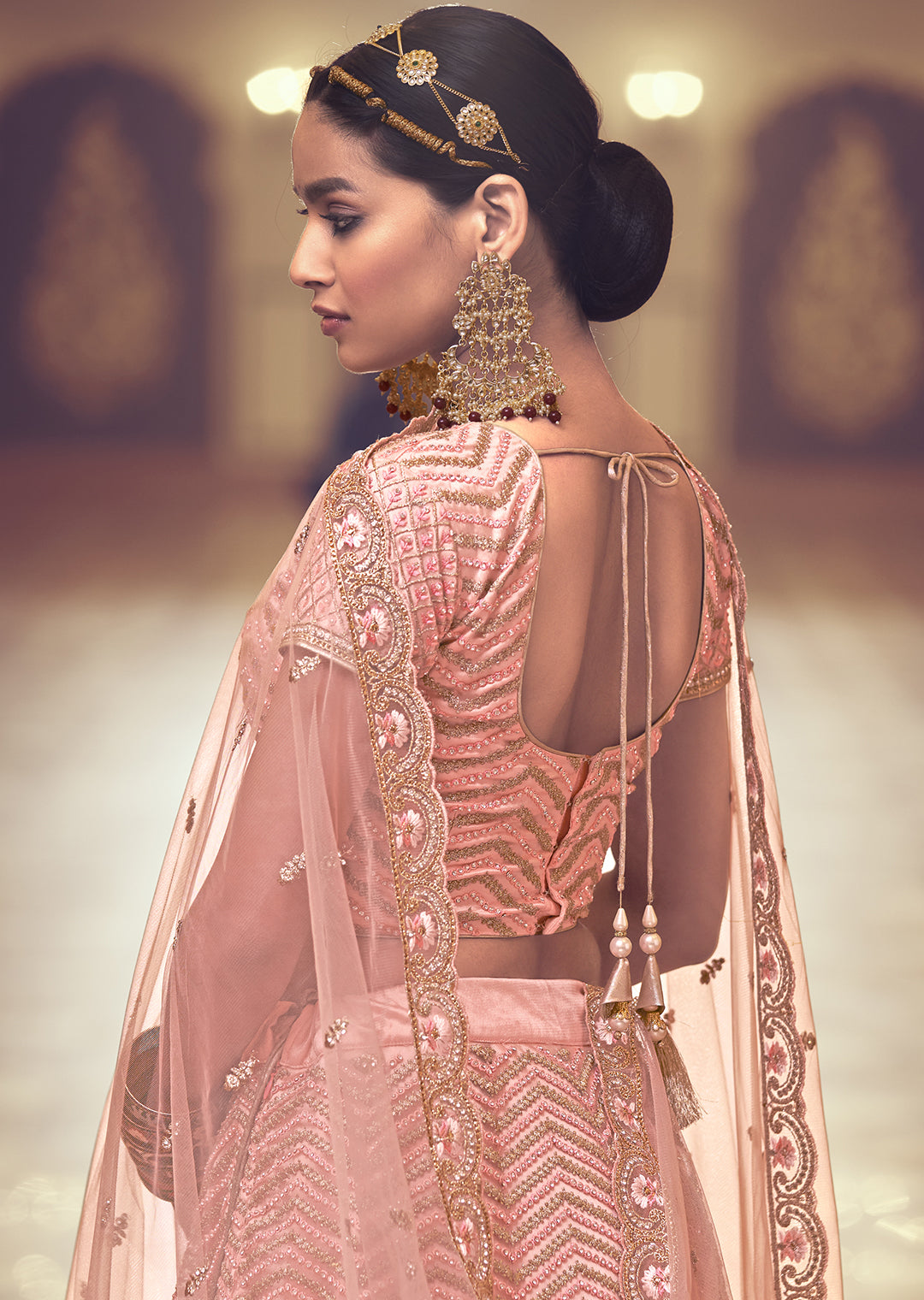 PEACH ORANGE HEAVY EMBROIDERED PREMIUM NET DESIGNER LEHENGA