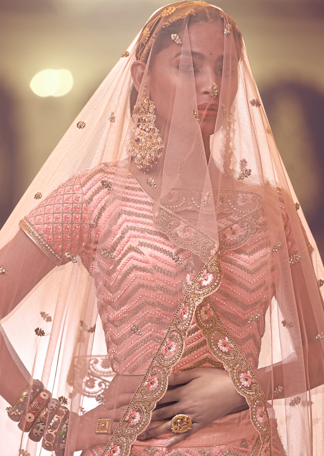PEACH ORANGE HEAVY EMBROIDERED PREMIUM NET DESIGNER LEHENGA