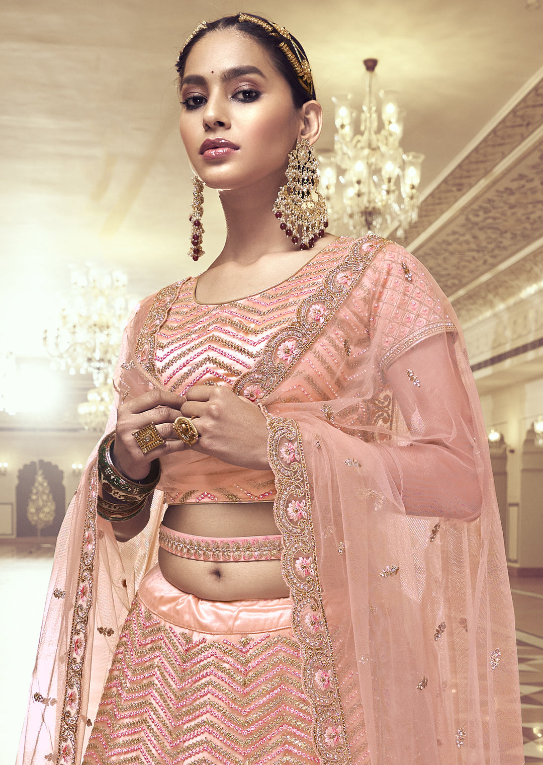PEACH ORANGE HEAVY EMBROIDERED PREMIUM NET DESIGNER LEHENGA