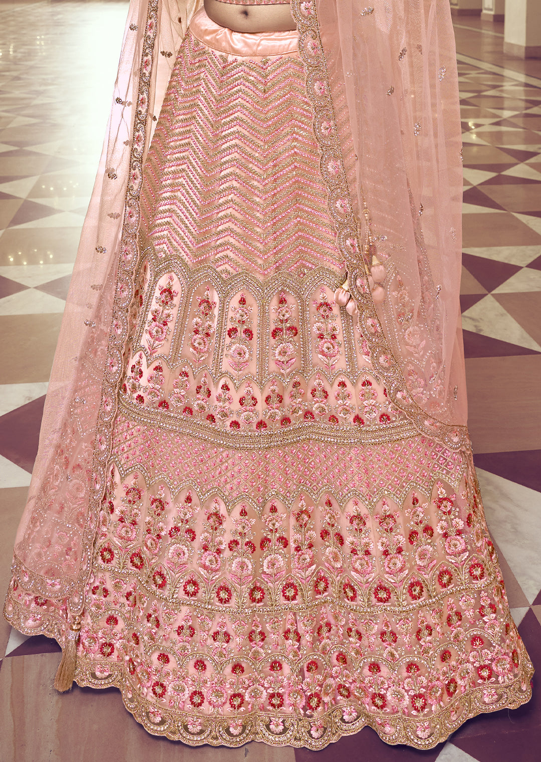 PEACH ORANGE HEAVY EMBROIDERED PREMIUM NET DESIGNER LEHENGA