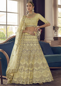 PARCHMENT YELLOW HEAVY EMBROIDERED DESIGNER LEHENGA
